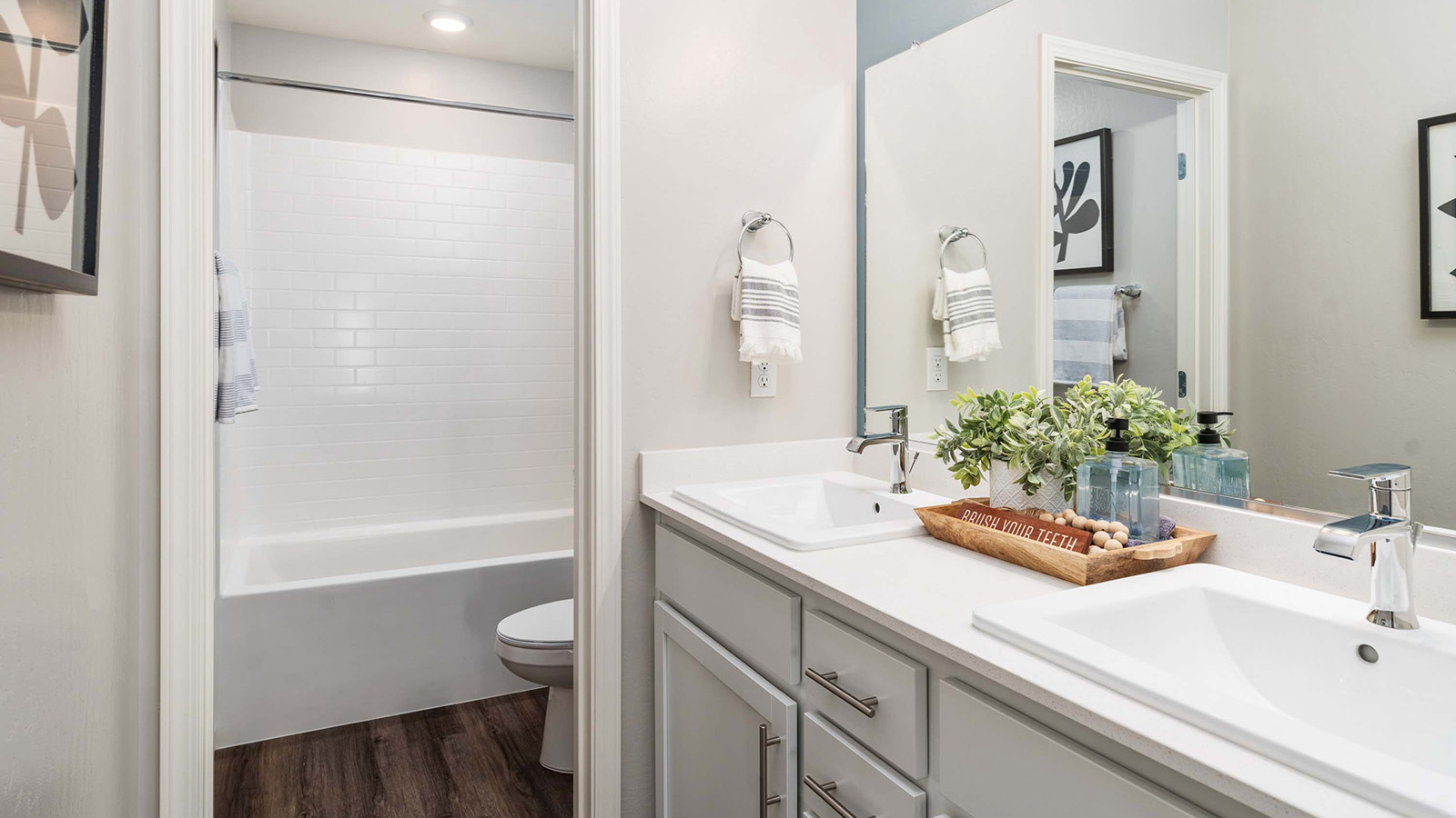 primary bathroom with white countertops