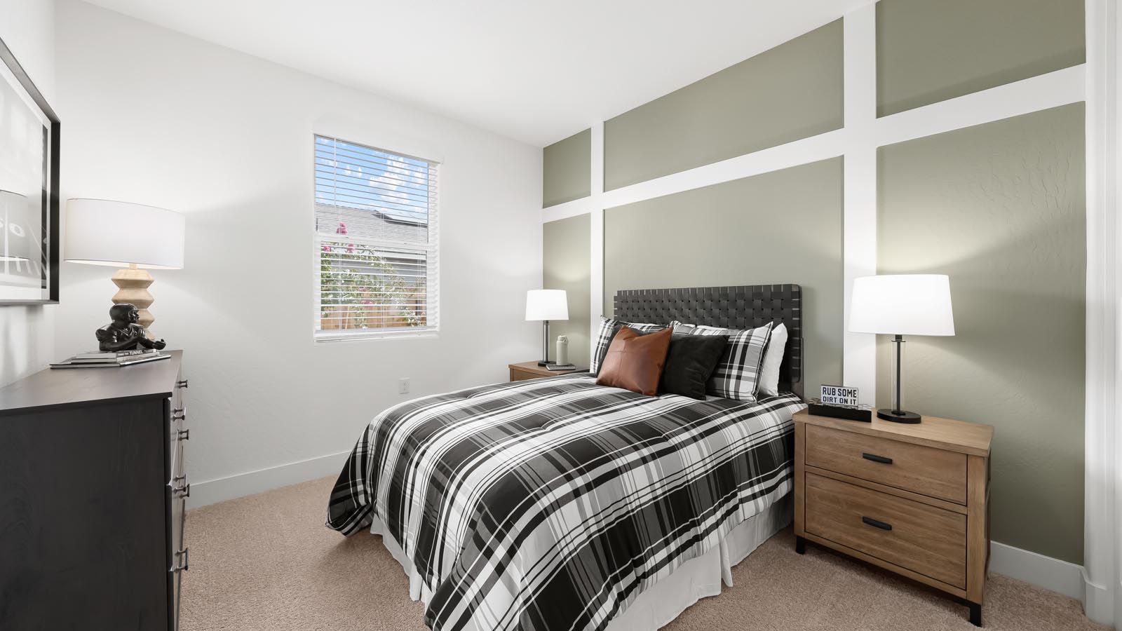guest bedroom with green accent wall