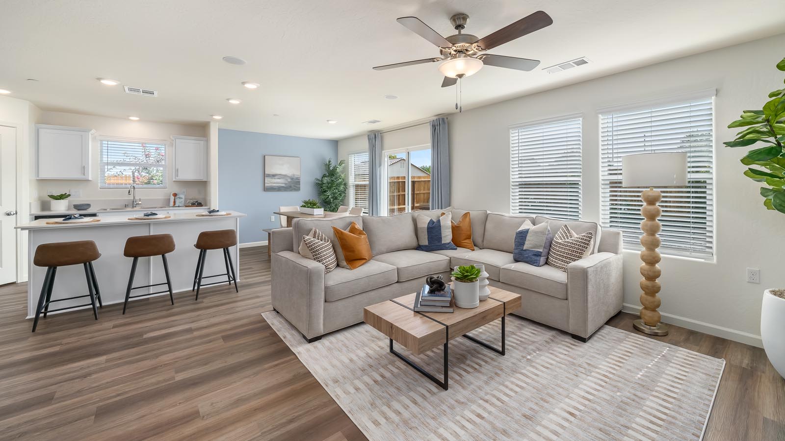 Interior photo of open concept living room leading to kitchen and dining room