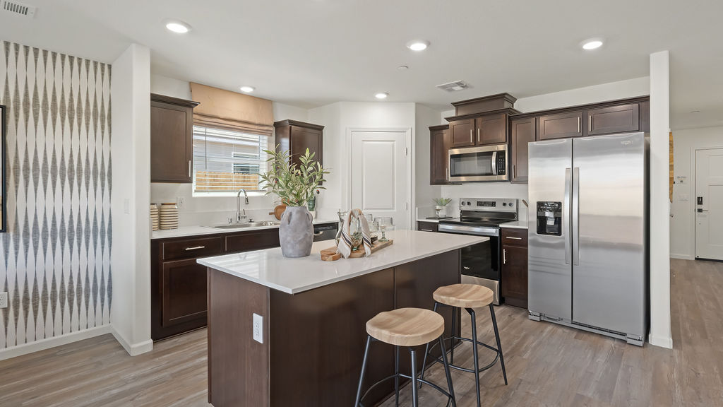 Kitchen with wood barstools.