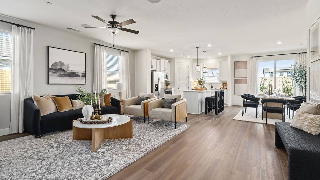Living room with navy couch and two chairs.