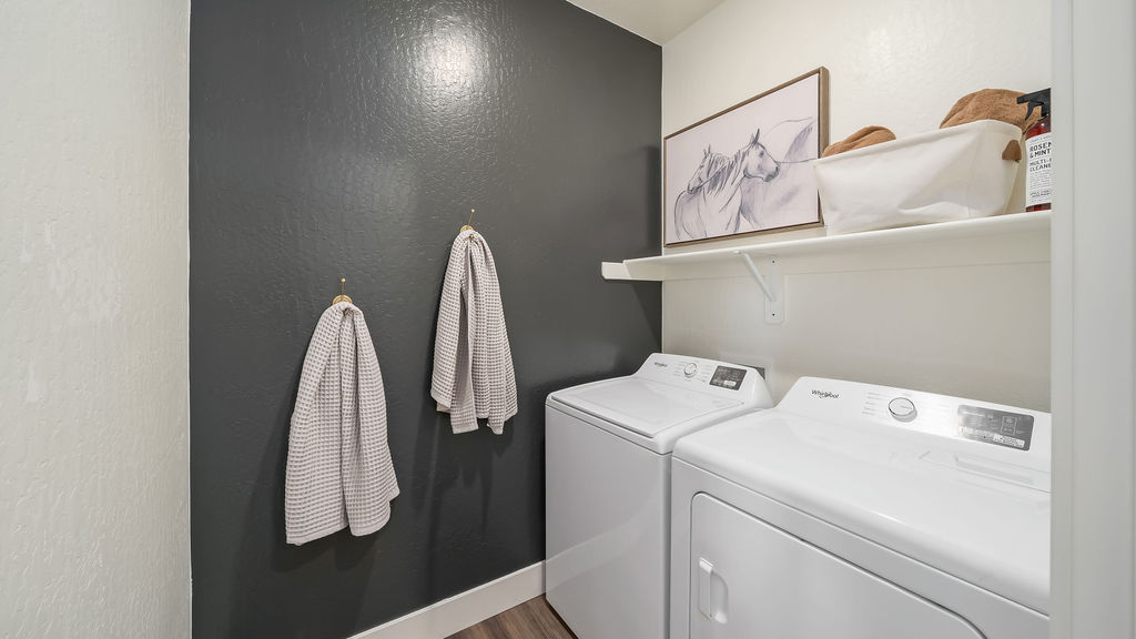 Laundry room with blue wall.