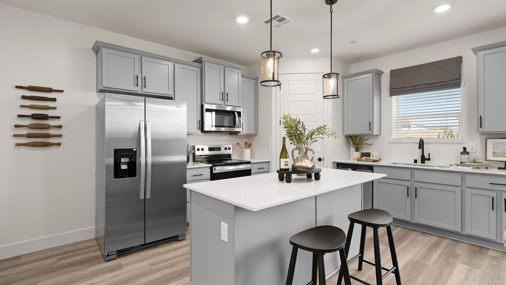 Kitchen with bar stools.