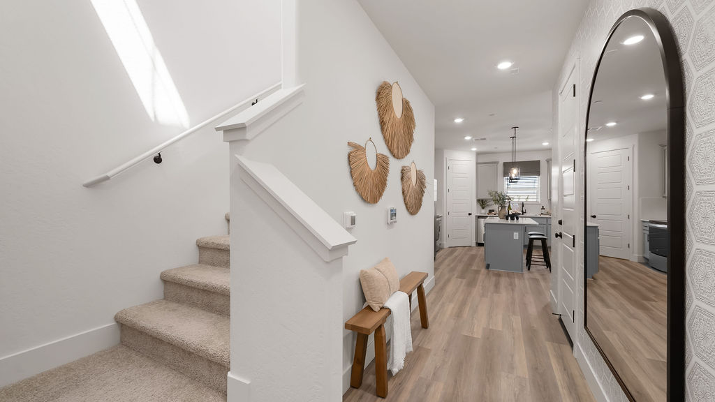 Entry way with large mirror.