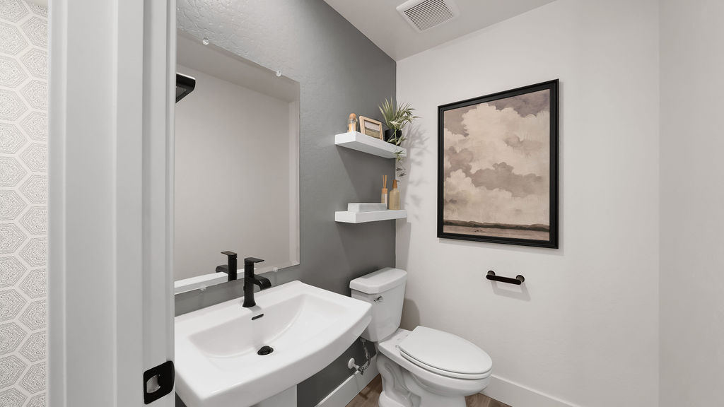 Bathroom one with a blue accent wall.