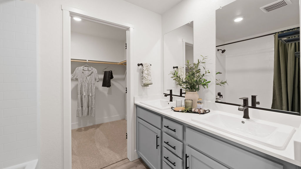 Primary bathroom and closet.