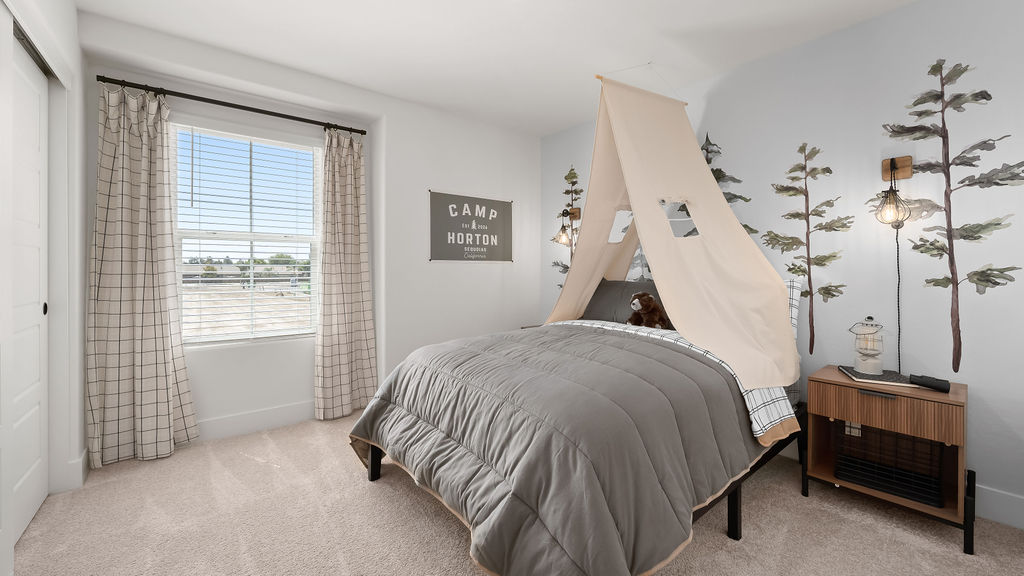 Bedroom with grey bedding.