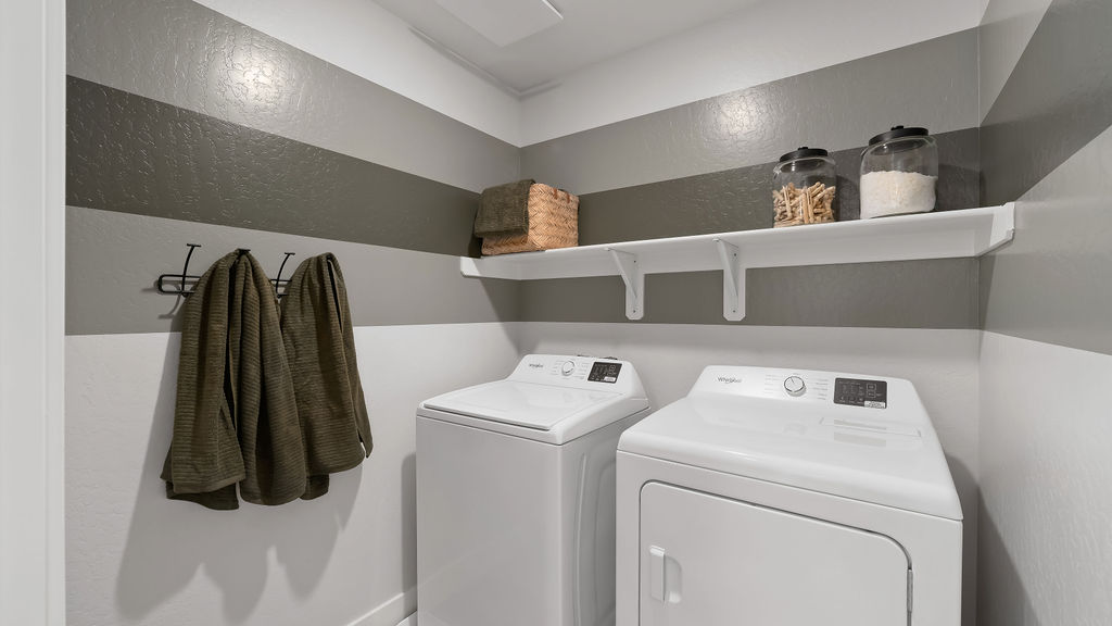 Laundry room with green accents.