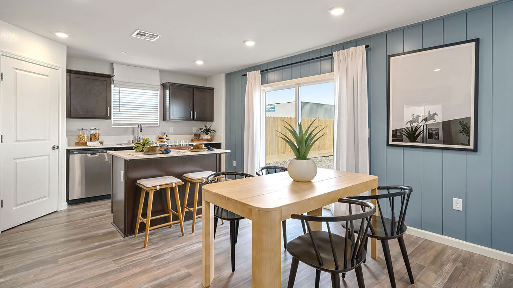 Dining area with blue accent wall.