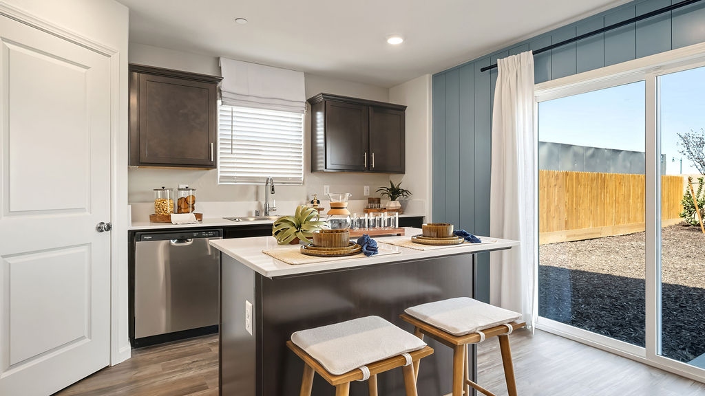 Kitchen with two wood barstools.