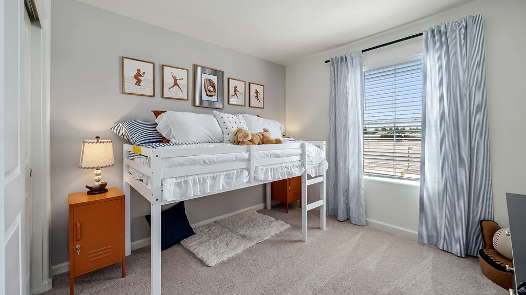 Kids room with blue curtains.