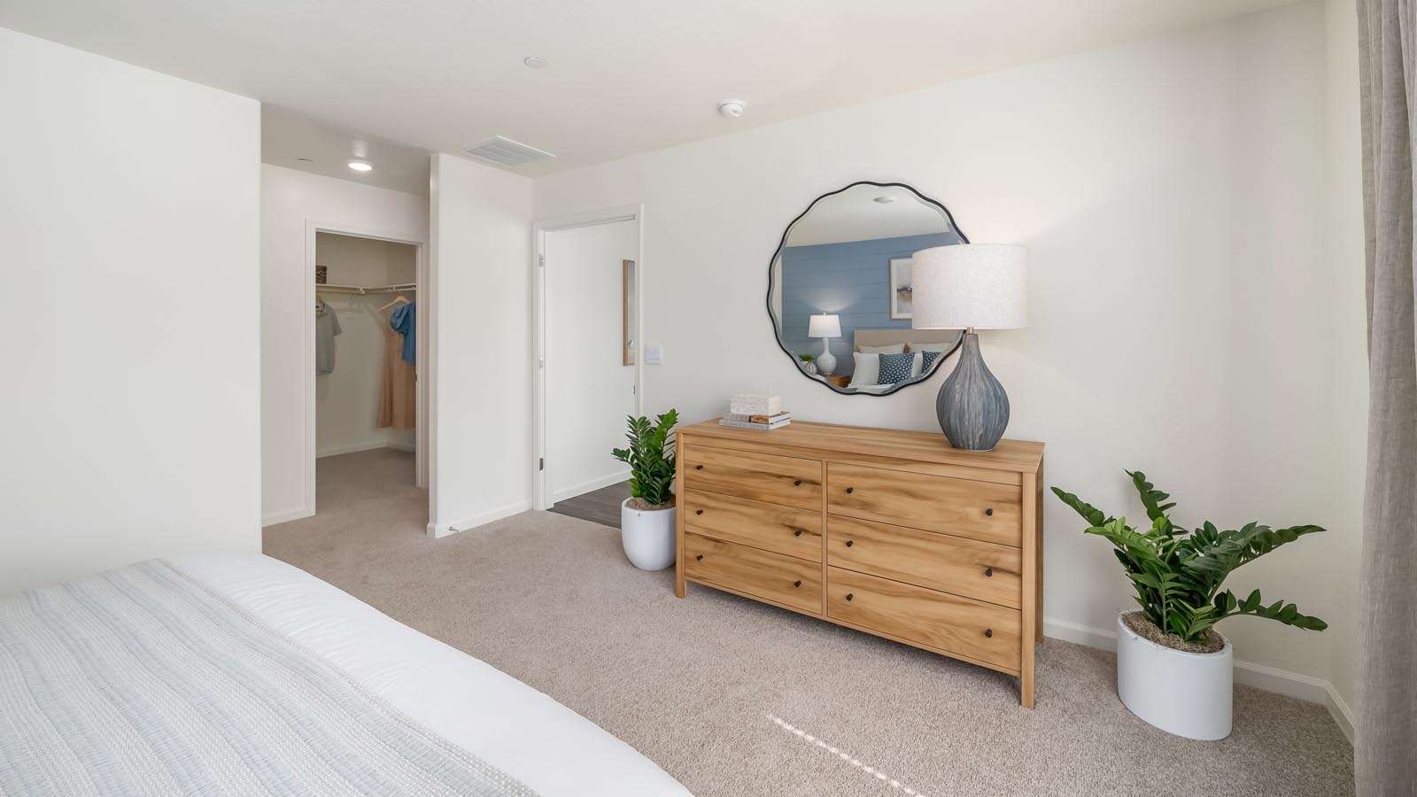Primary bedroom with king sized bed and matching end tables