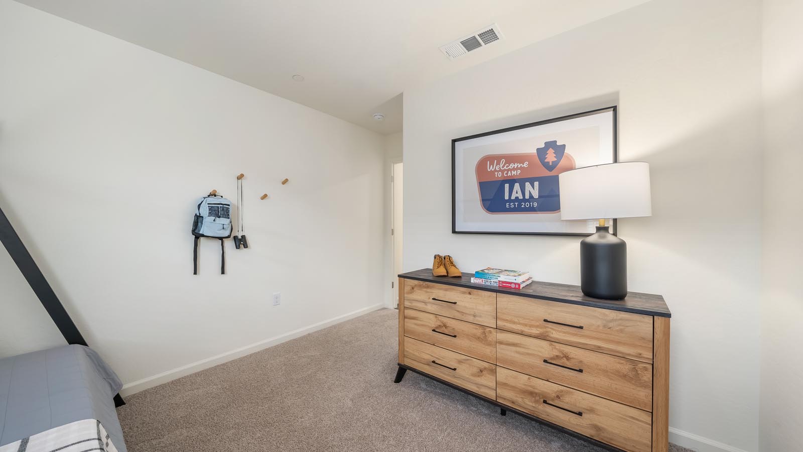Kid's bedroom with mural on wall