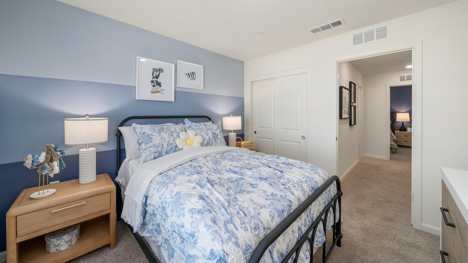Guest bedroom with blue accent wall