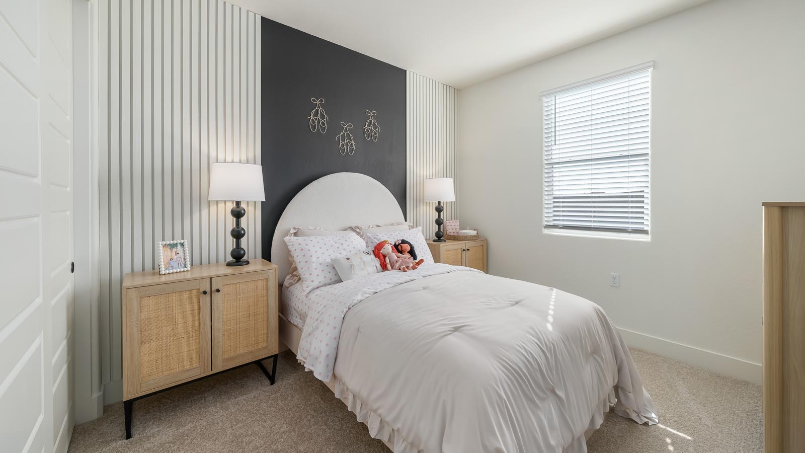 Interior photo of child's bedroom with black accent wall