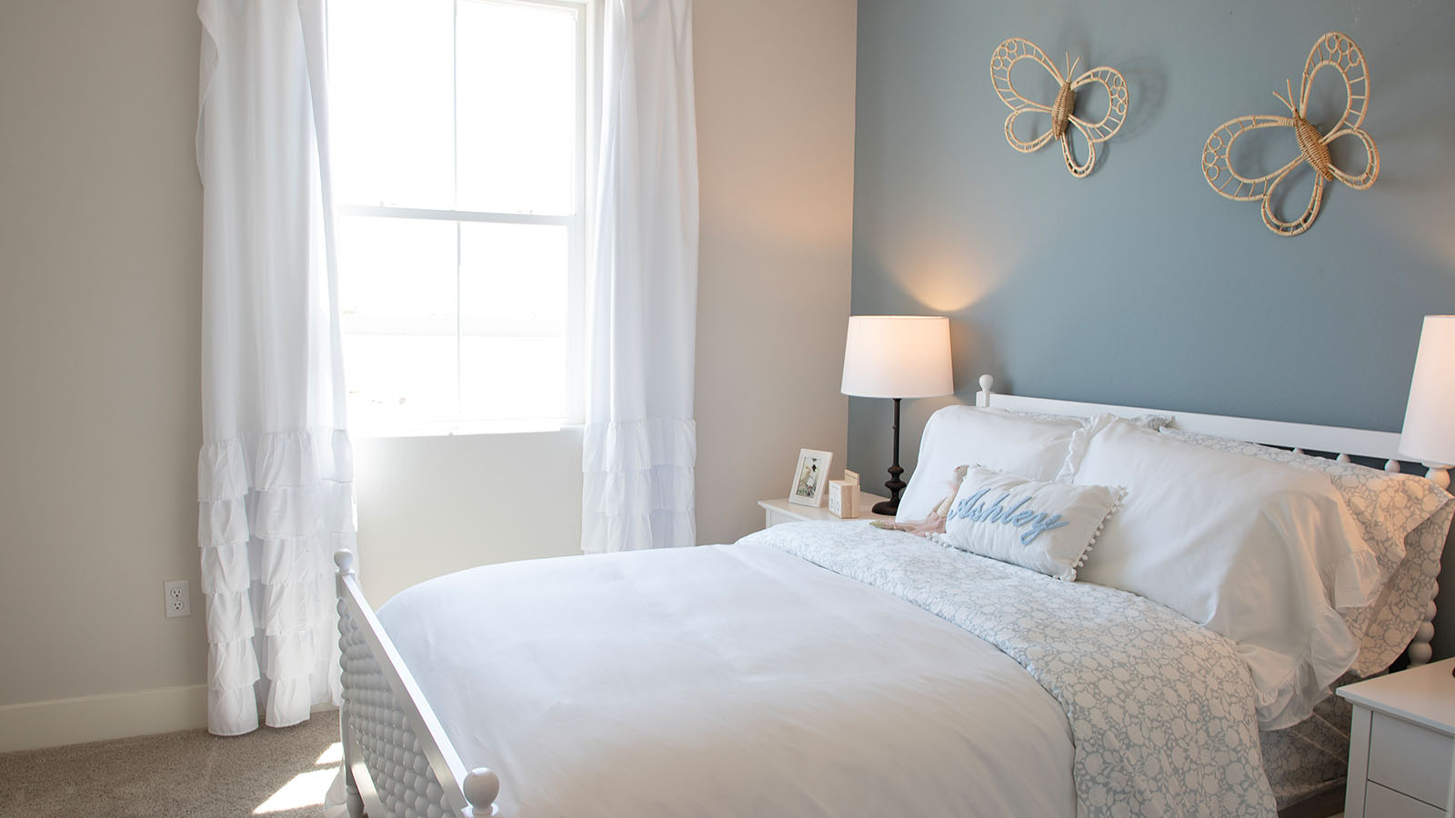 kids bedroom with white bedding.