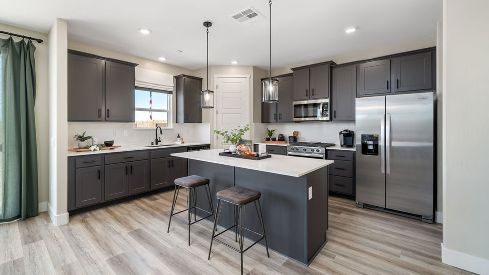kitchen with dark grey cabinets.