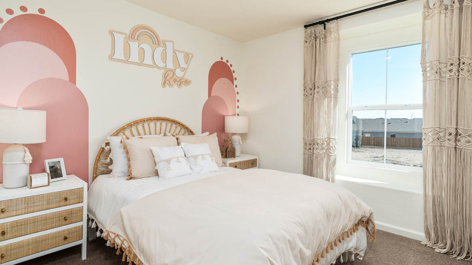 Bedroom with pink accents on the wall.