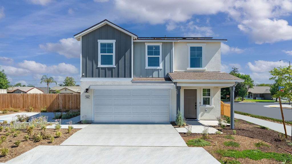 Two story home with two car garage.