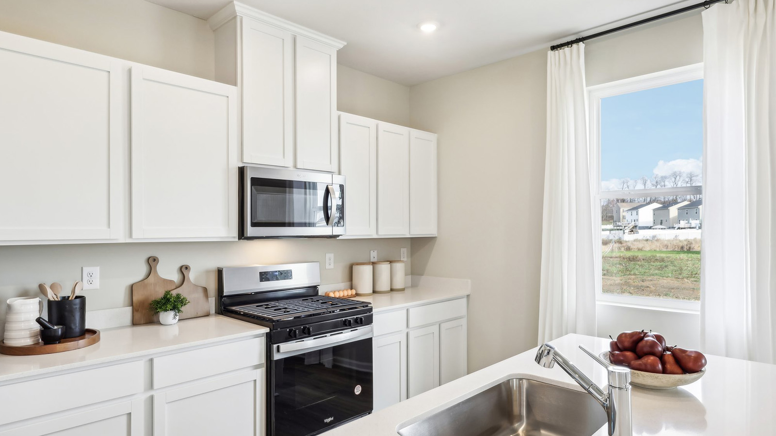 kitchen with white cabinets and countertops