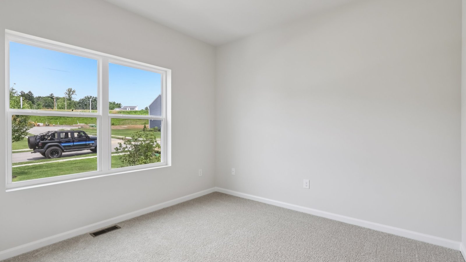 Secondary bedroom with large window