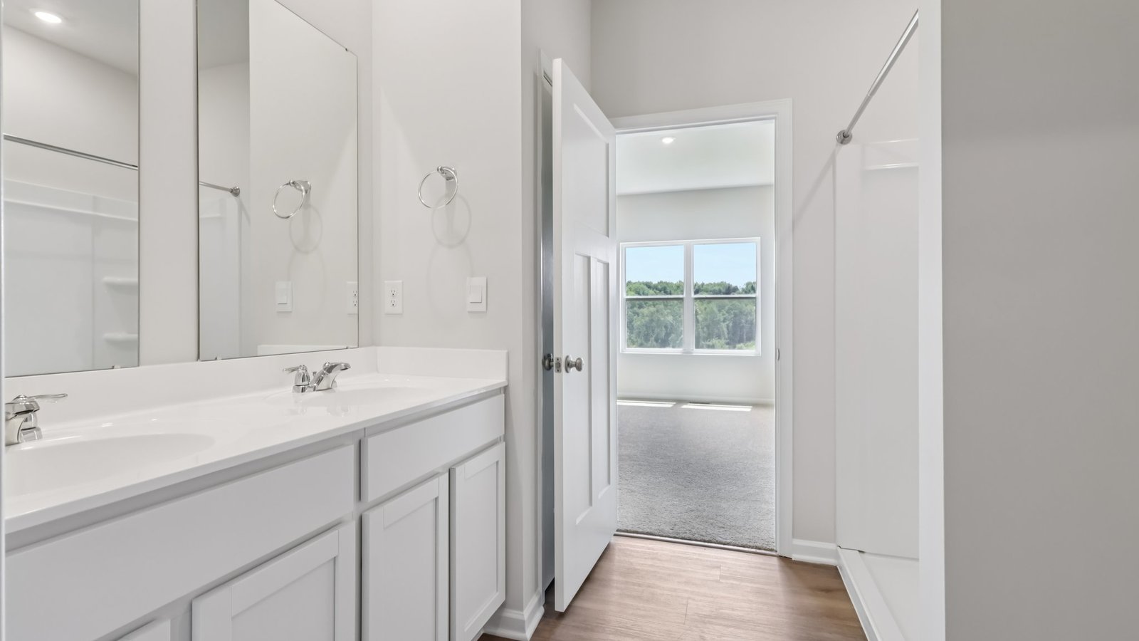Primary ensuite bathroom with double sinks