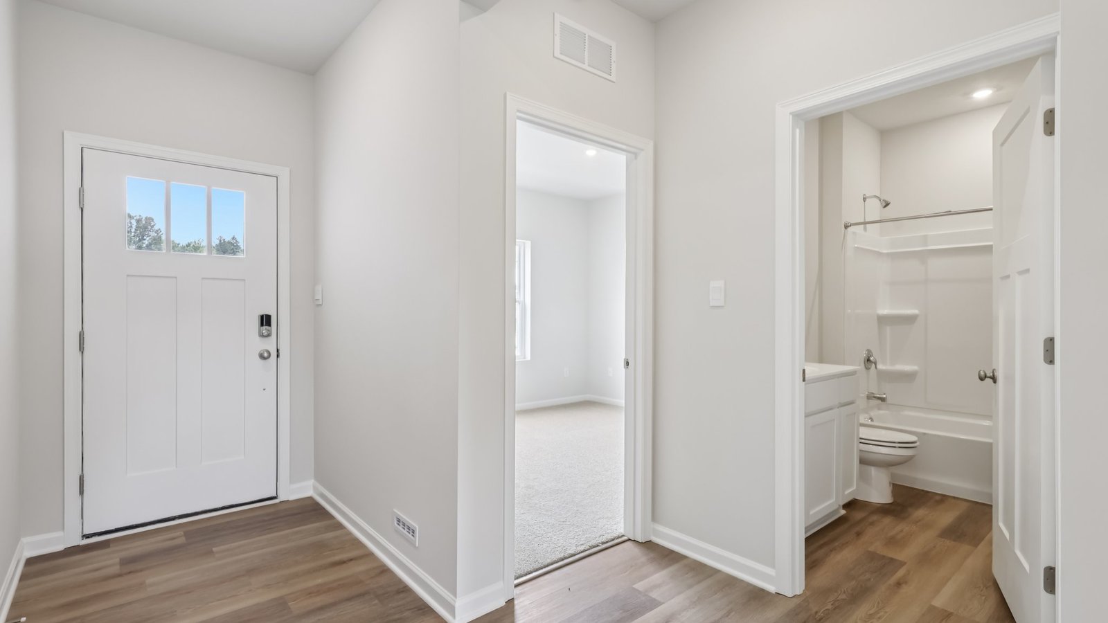 Entry way with secondary bedroom and half bath
