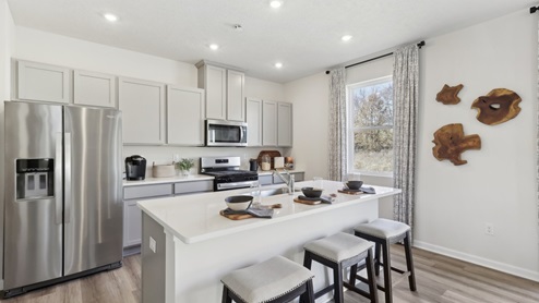 Galen kitchen with large island and quartz countertops