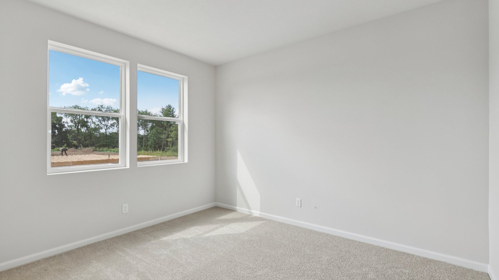 secondary bedroom with large windows