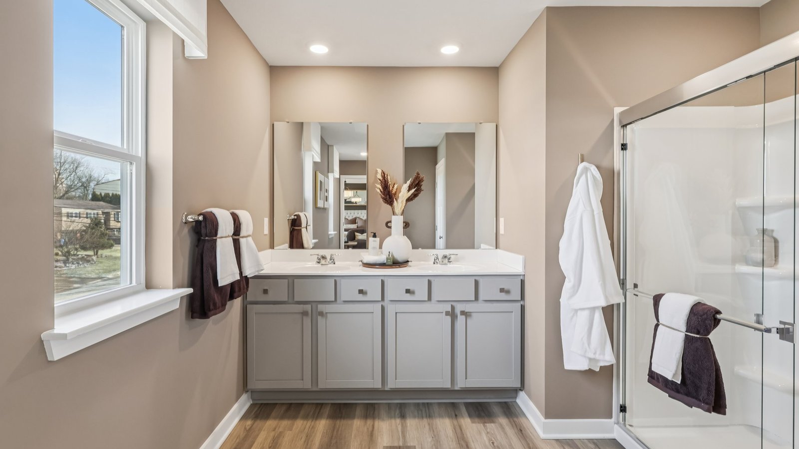 Primary ensuite bathroom with glass shower door