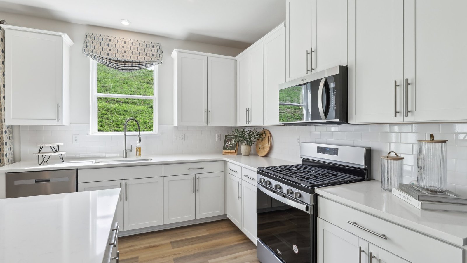 kitchen with window and stainless steel appliances