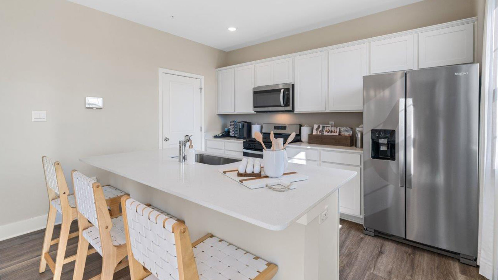 kitchen with white cabinets and countertops