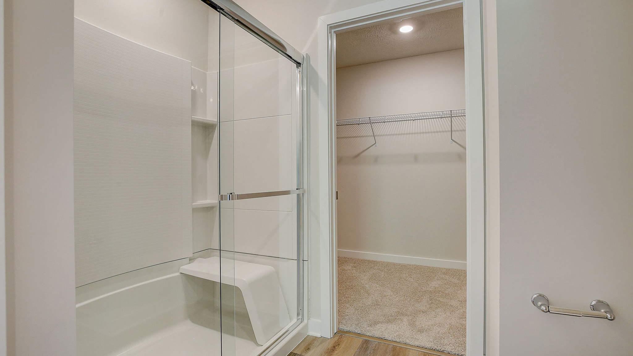 primary ensuite with glass sliding shower door