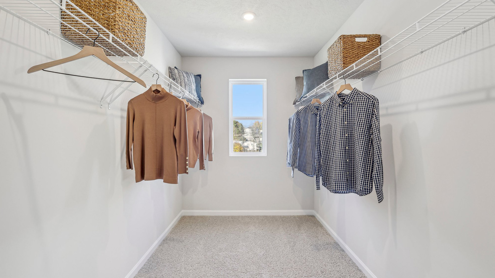 Primary bedroom walk-in closet