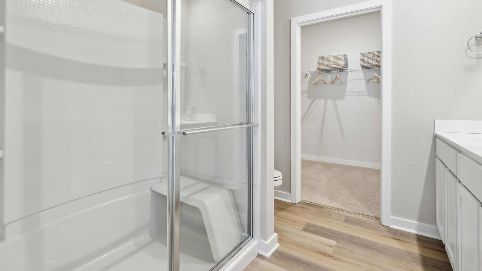 Primary ensuite bathroom with glass shower door