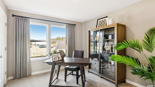 Lower level bonus room shown as office with large windows