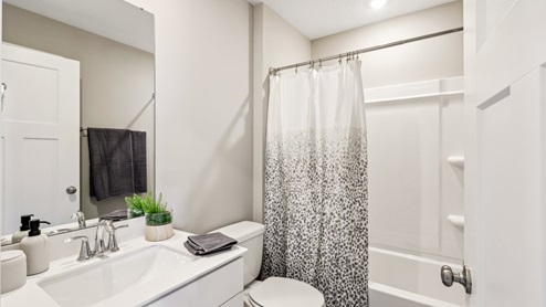 Upper level full bath with tub and shower