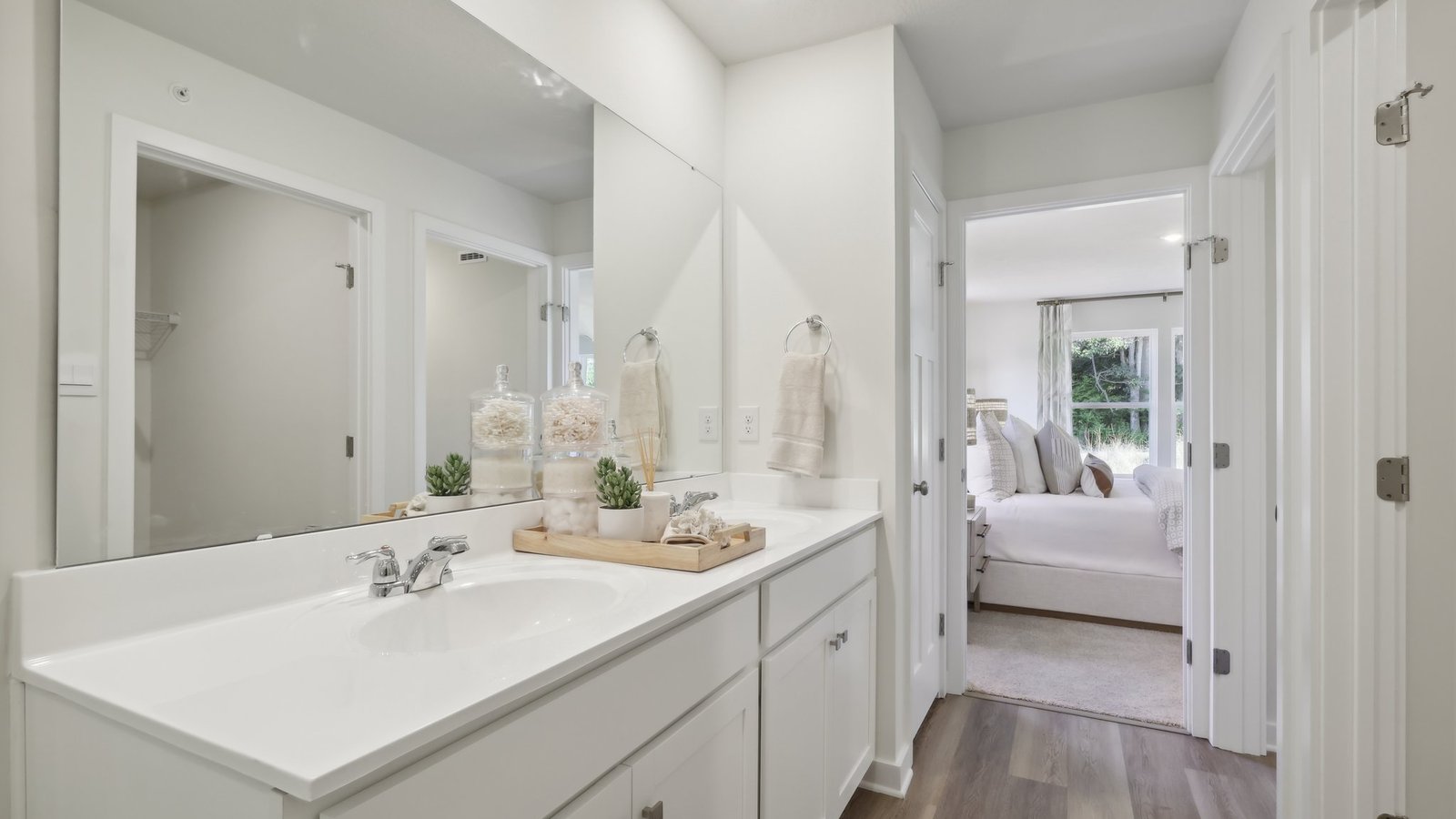 Primary ensuite full bath with dual vanity