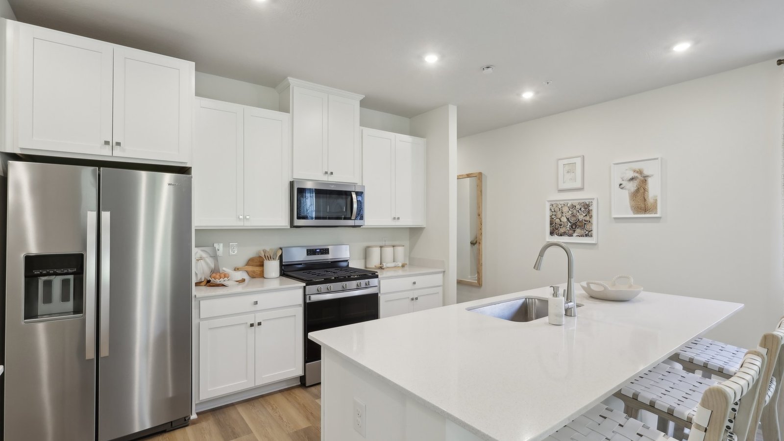Kitchen area with white countertops