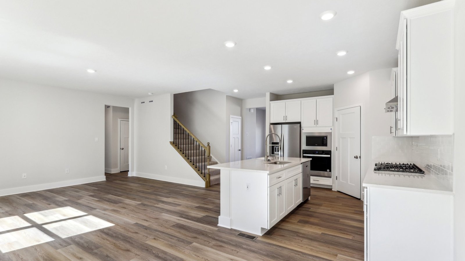 Open living area with kitchen and living room