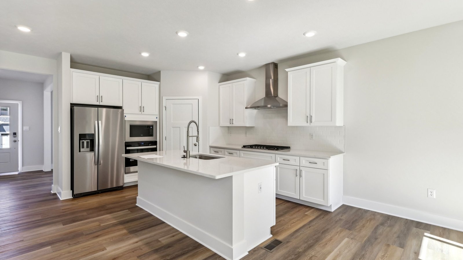 Kitchen with white countertops and cabinets