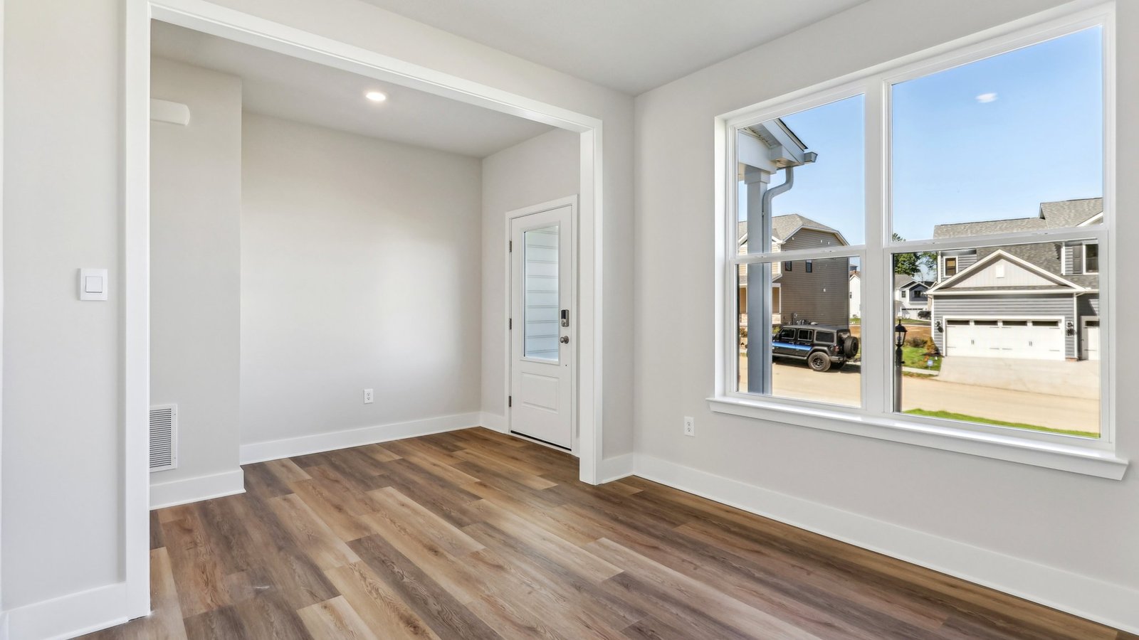 Main level flex space at front of house with large window