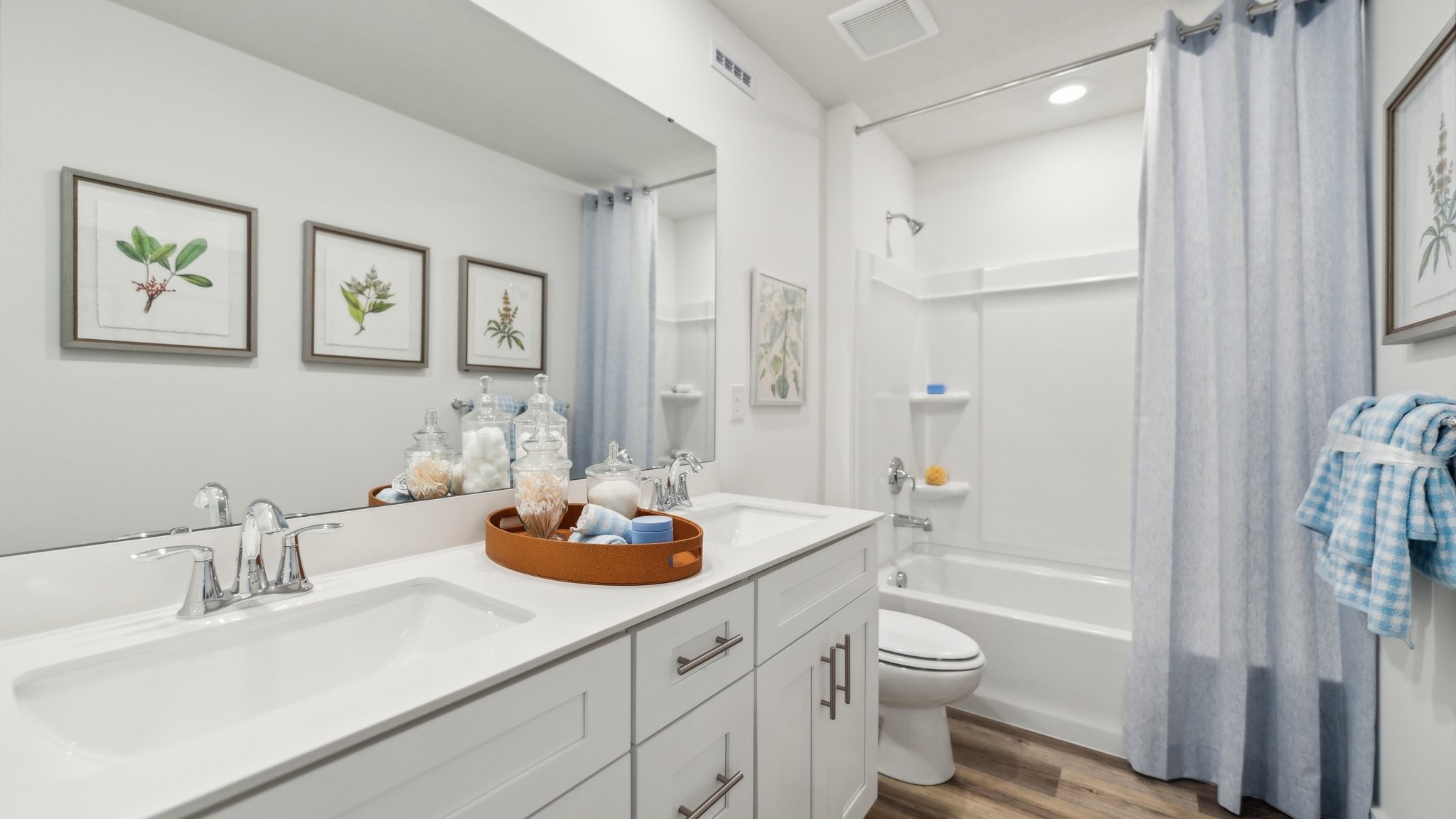 Secondary full bath with white countertops