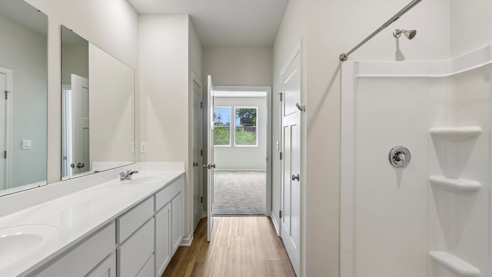 Primary ensuite bathroom with dual sinks