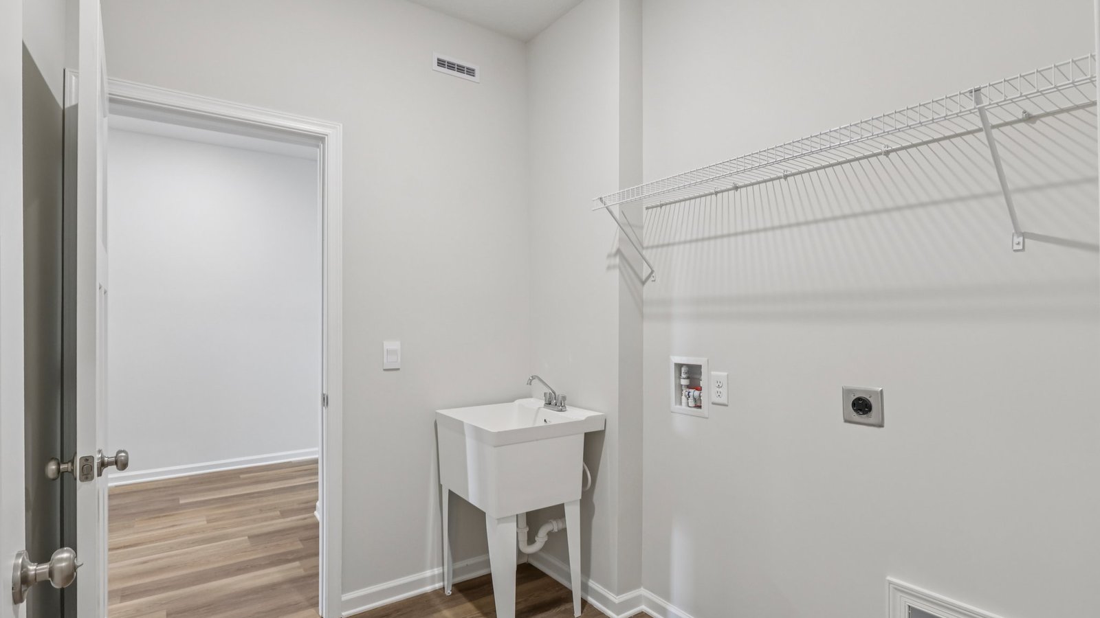 Laundry room attached to primary walk-in closet