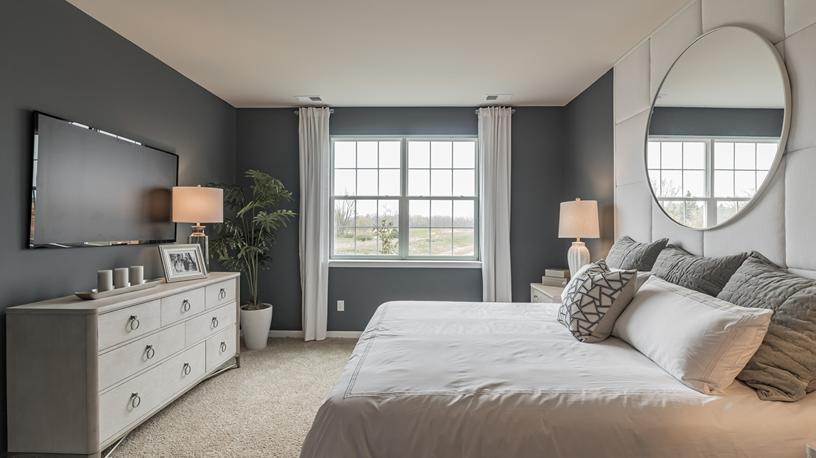 Large primary bedroom suite staged