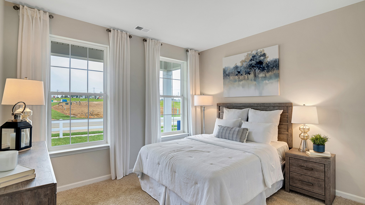 Second bedroom with two windows staged