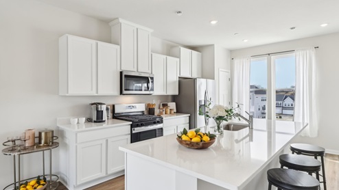 kitchen with large 9 foot island and window