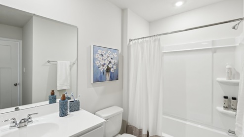 secondary full bath with tub and shower