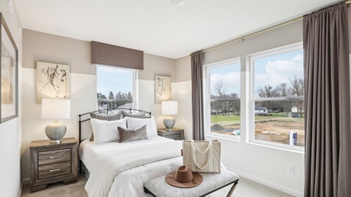 secondary bedroom with two large windows